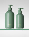 CORPUS Nº Green Aromatic Body Wash and Body Cream pump bottles side by side on a glass shelf